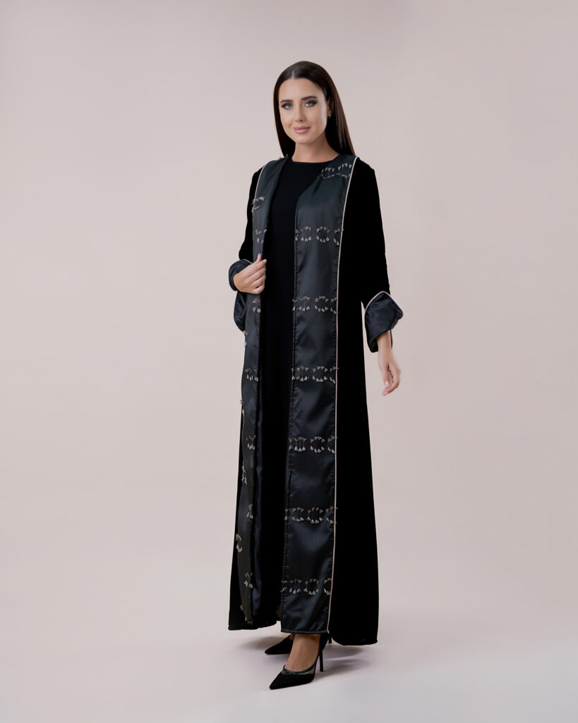 Fashion-forward abaya design presented in a studio.