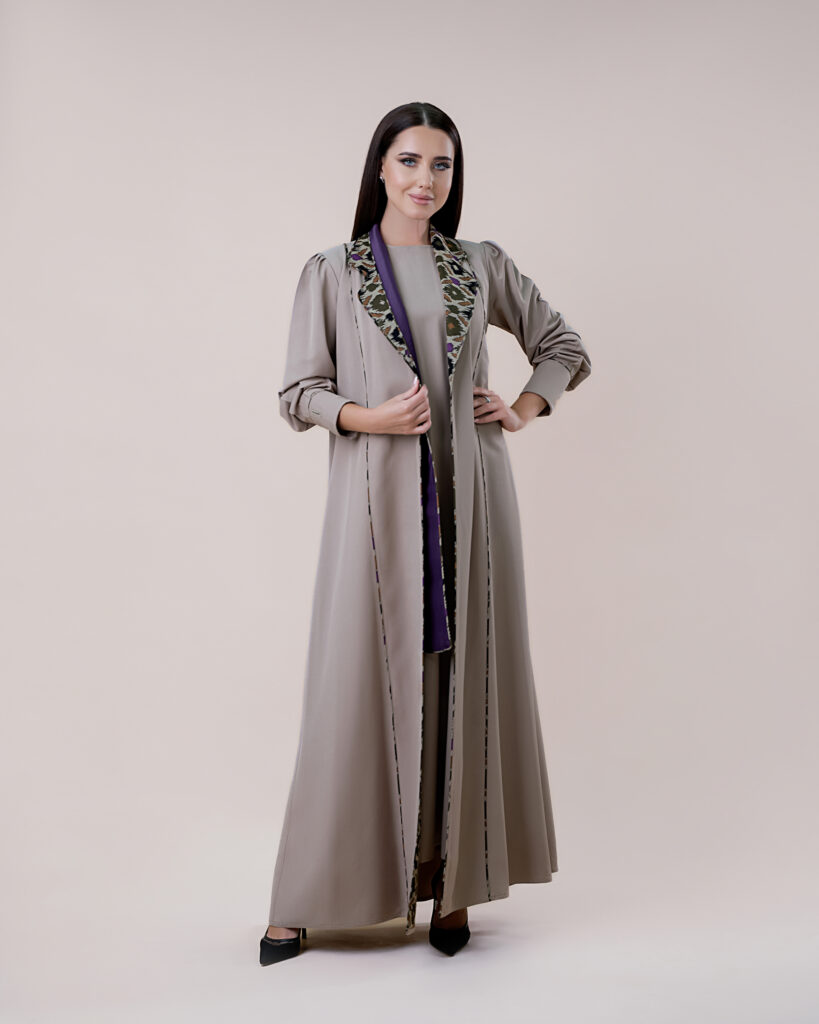 Dubai model presenting a chic abaya ensemble.