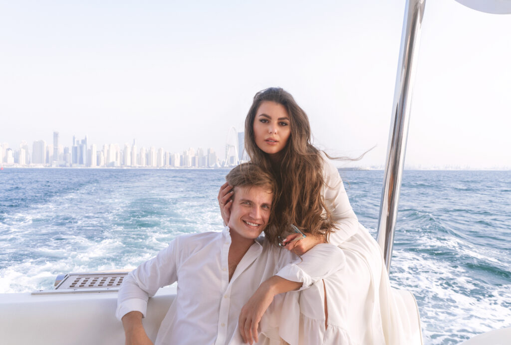 Couple Standing Together at the Stern of Yacht