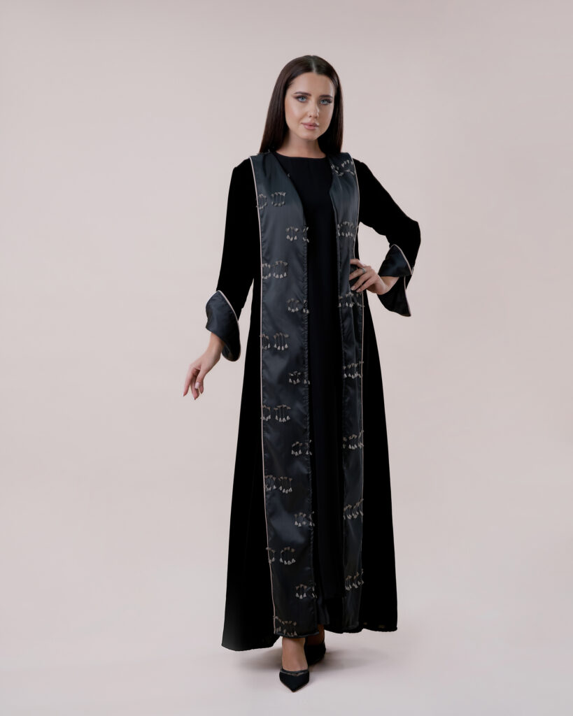 Model showcasing the beauty of the abaya in a controlled studio environment.